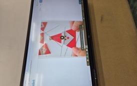 Mikołaj origami wyświetlonyna monitorze multimedialnym